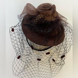 Brown Feathered Veiled fascinator